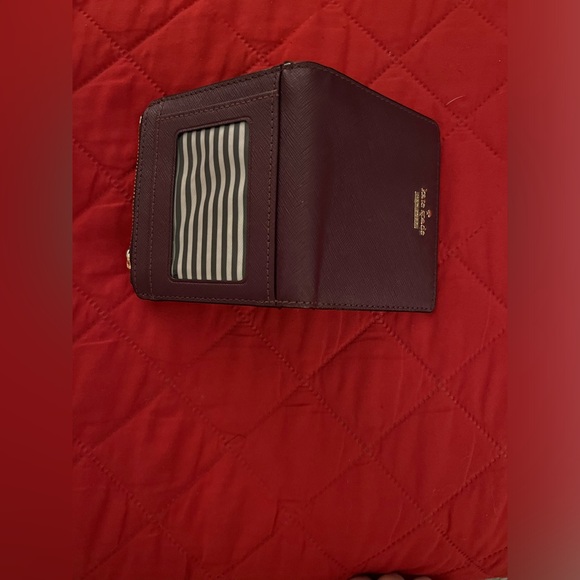 Kate Spade Burgundy/Wine Bifold Wallet with Gold Tone Accents. - Picture 2 of 9
